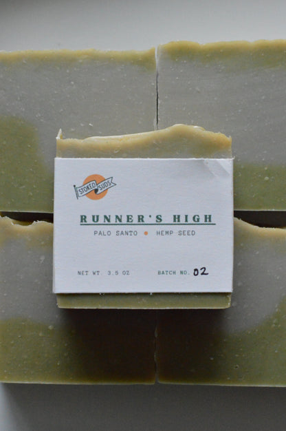 Green soap bar with a label on a gray background