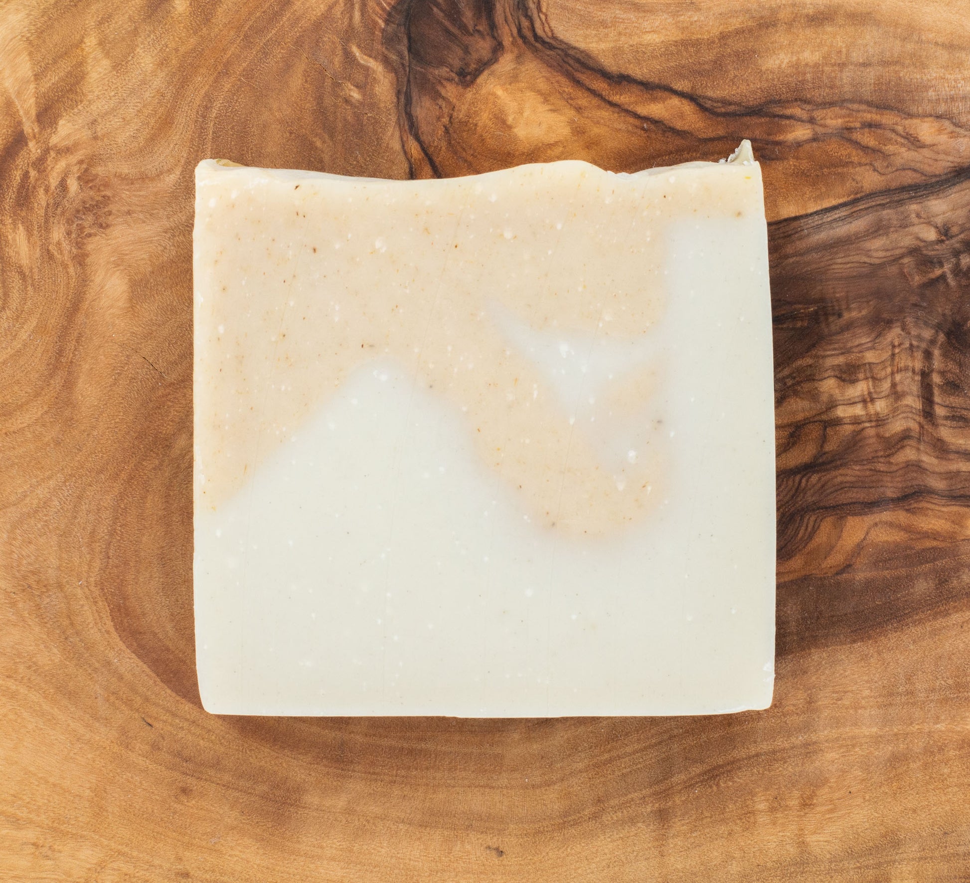 Bar of soap on a wooden surface