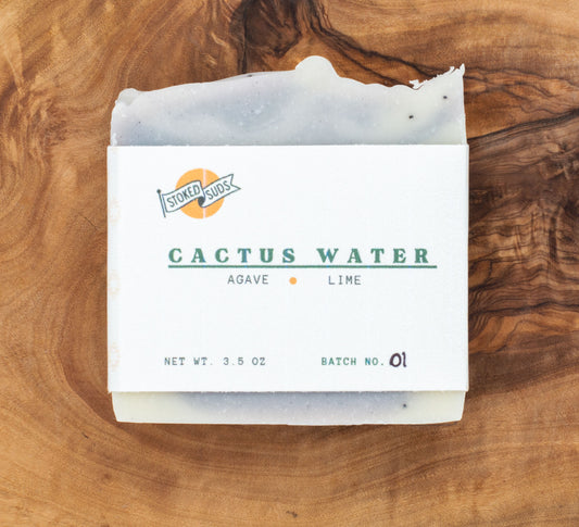 Bar of soap labeled 'Cactus Water' on a wooden surface