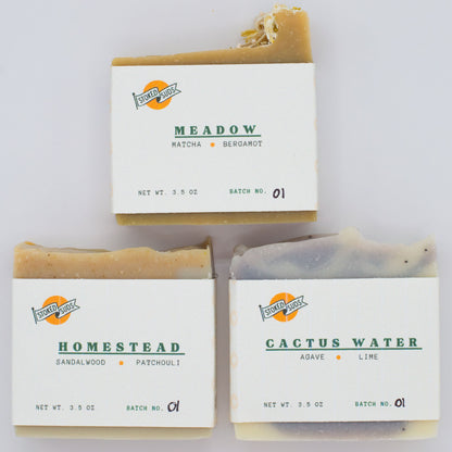 Three bars of soap with labels on a white background